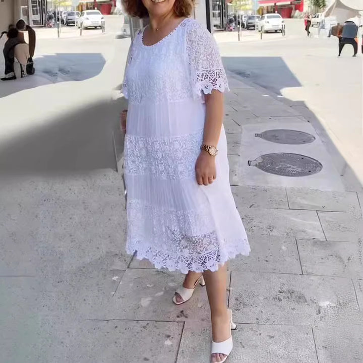 Women's midi dress with lace tiers, pleated inserts and short trumpet sleeves StylebySassy