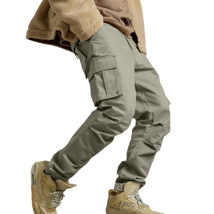 Men's multi-pocket casual trousers made of cotton twill with tapered leg and adjustable ankle drawstring StylebySassy