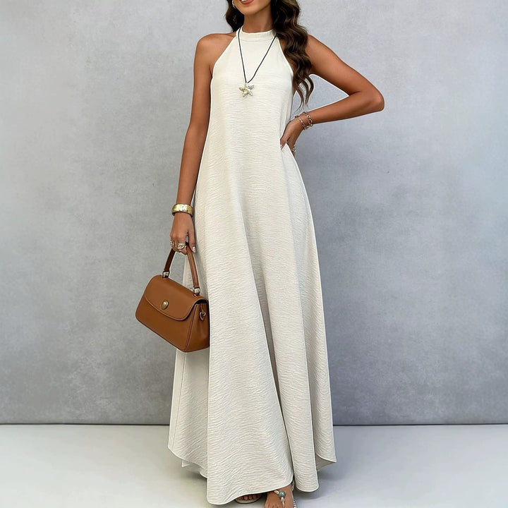 Women’s sleeveless maxi dress with high standing collar, flowing A-line and crepe texture StylebySassy
