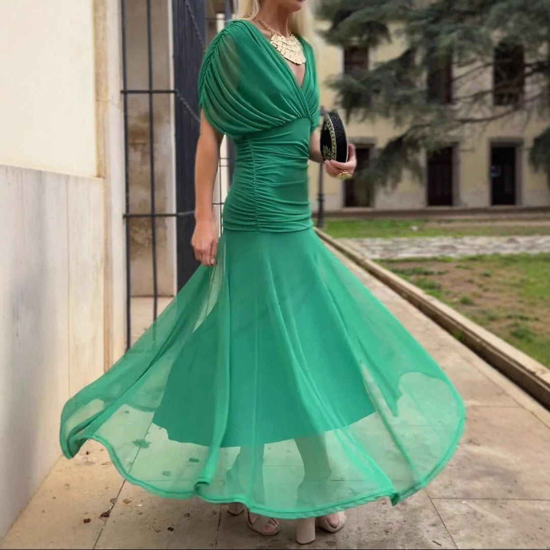 Ladies elegant floor-length evening dress with draped shoulder area and airy chiffon skirt StylebySassy