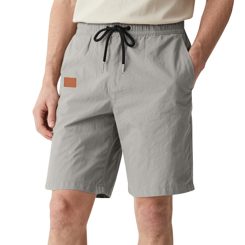 Men's quick-drying swim shorts in Bermuda cut with elastic waistband and drawstring StylebySassy