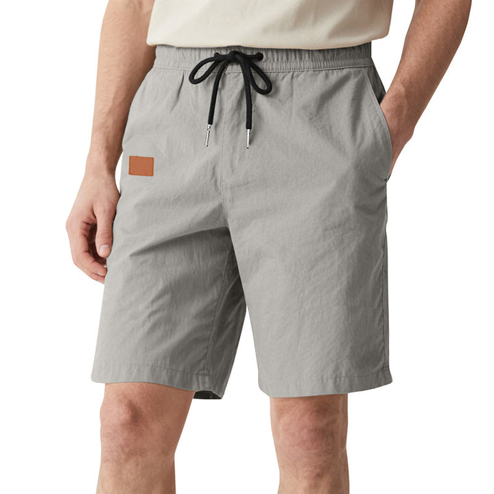 Men's quick-drying swim shorts in Bermuda cut with elastic waistband and drawstring StylebySassy