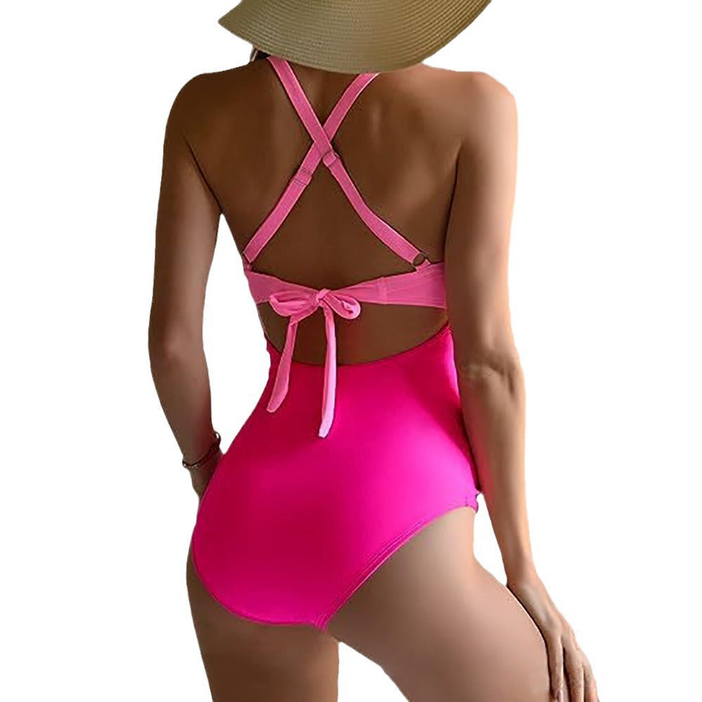 Women's one-piece swimsuit with stylish wrap design and sophisticated cross straps StylebySassy