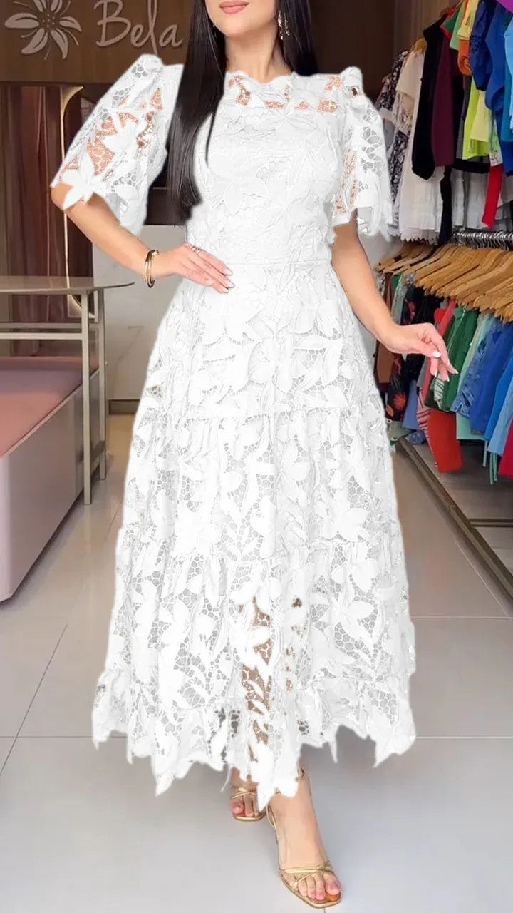 Women's maxi dress made of floral guipure lace with a fitted silhouette and tiered hem StylebySassy