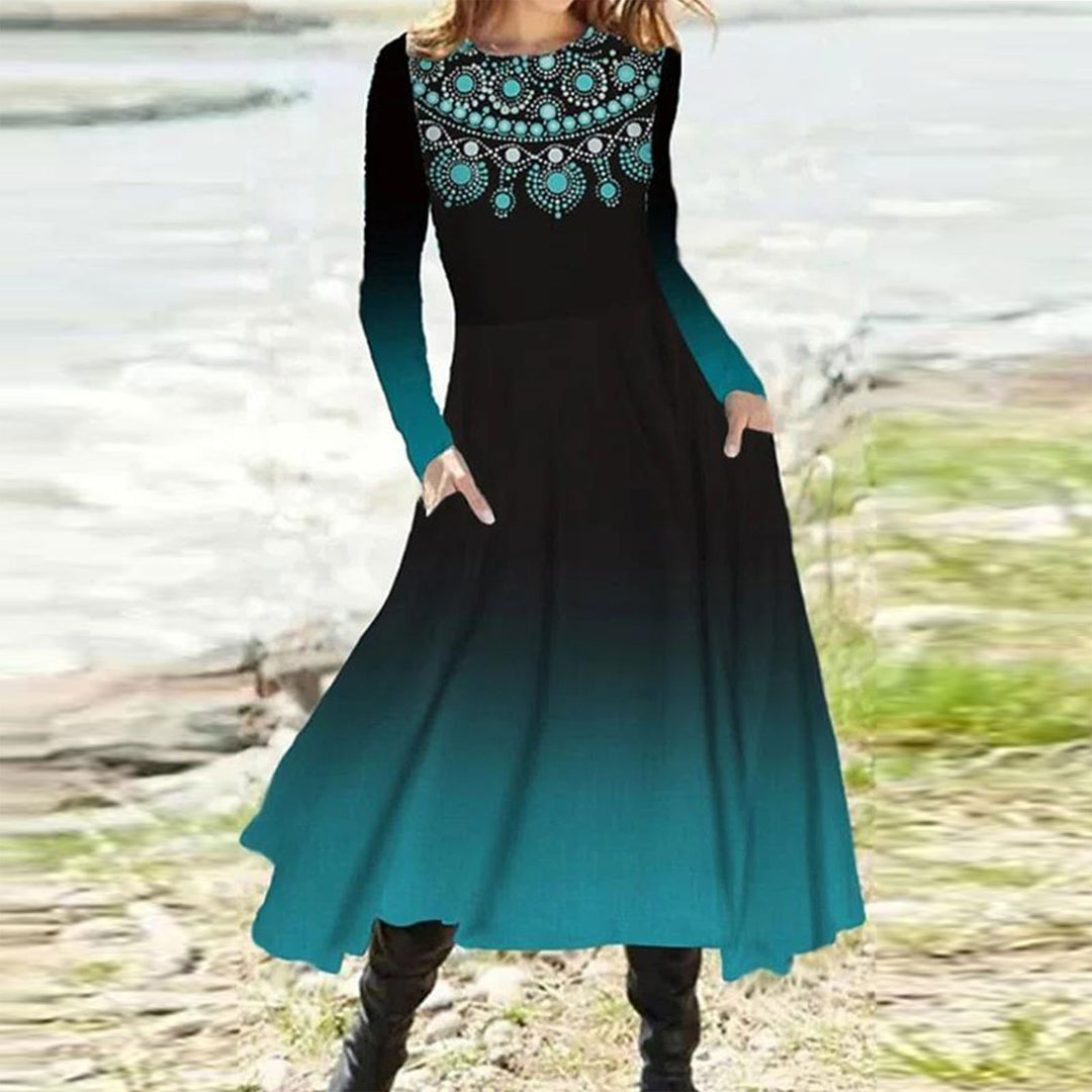 Women's flowing maxi dress with tie-dye circle pattern, round neckline, waist seam, and side pockets StylebySassy