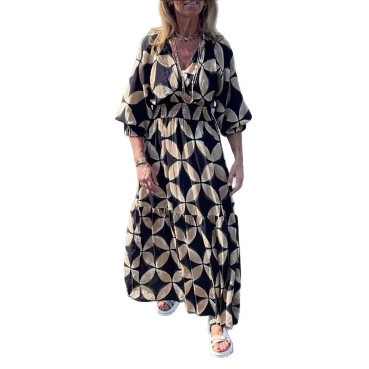 Women's maxi dress with geometric all-over print, smocked waist and ruffled tiers StylebySassy