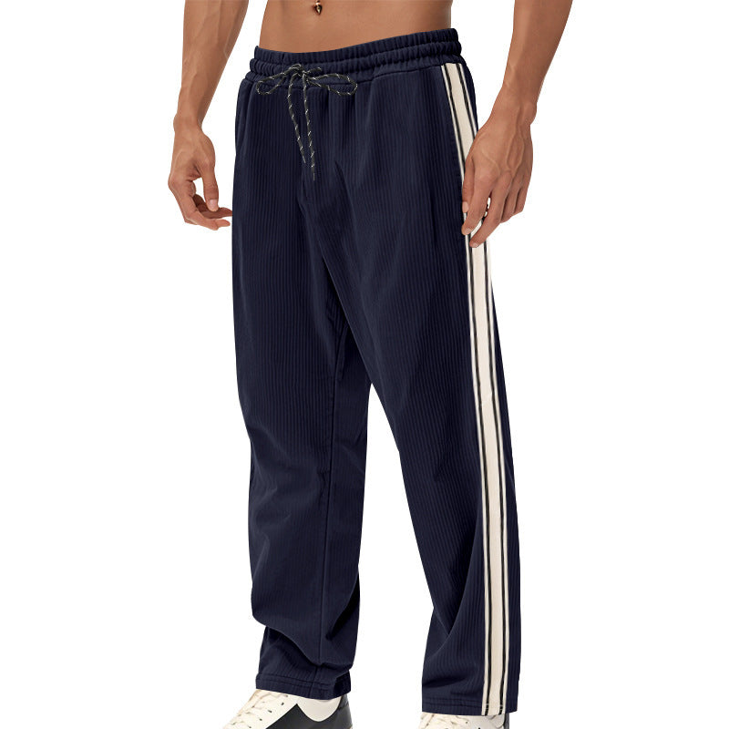 Men's loose training pants in corduroy look with drawstring waistband and side contrast stripes StylebySassy