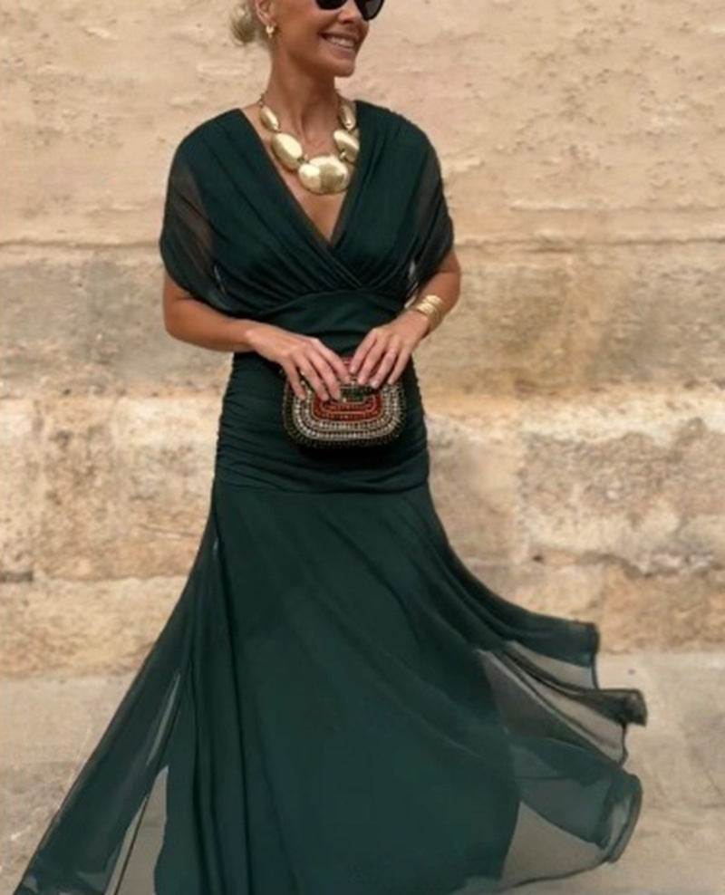 Ladies elegant floor-length evening dress with draped shoulder area and airy chiffon skirt StylebySassy