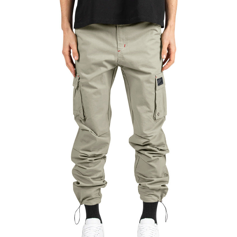 Men's multi-pocket casual trousers made of cotton twill with tapered leg and adjustable ankle drawstring StylebySassy