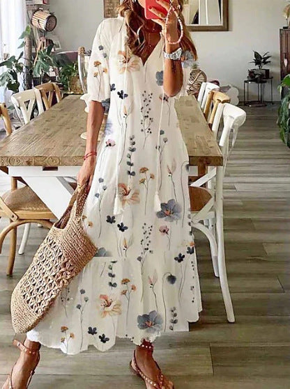 Women’s airy maxi dress in A-line with V-neck, casual rolled sleeves and floral all-over print StylebySassy