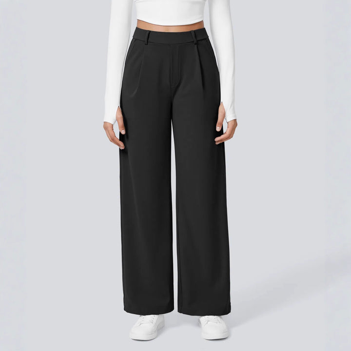 Ladies high-waisted pleated trousers with wide leg, belt loops and side pockets StylebySassy