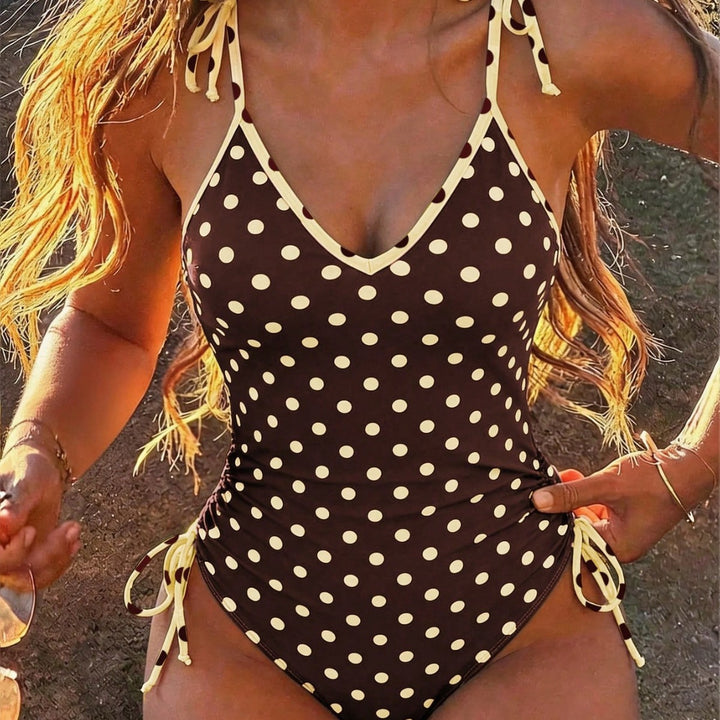 Women's one-piece swimsuit with playful polka dot design StylebySassy