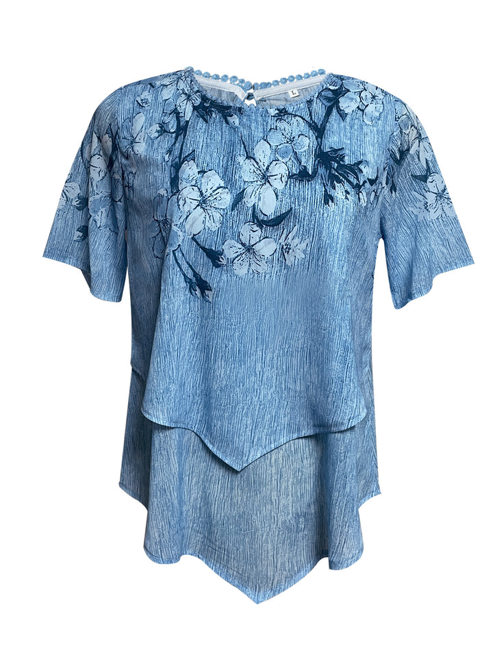 Women's two-layer blouse dress with asymmetrical tiered hem, floral print yoke, and wing sleeves StylebySassy