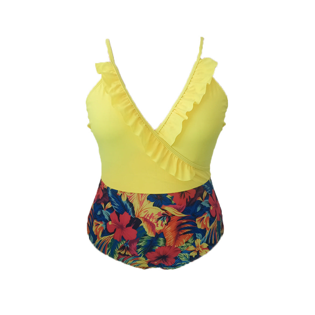 Women's one-piece swimsuit with asymmetrical ruffle design and floral pant area StylebySassy