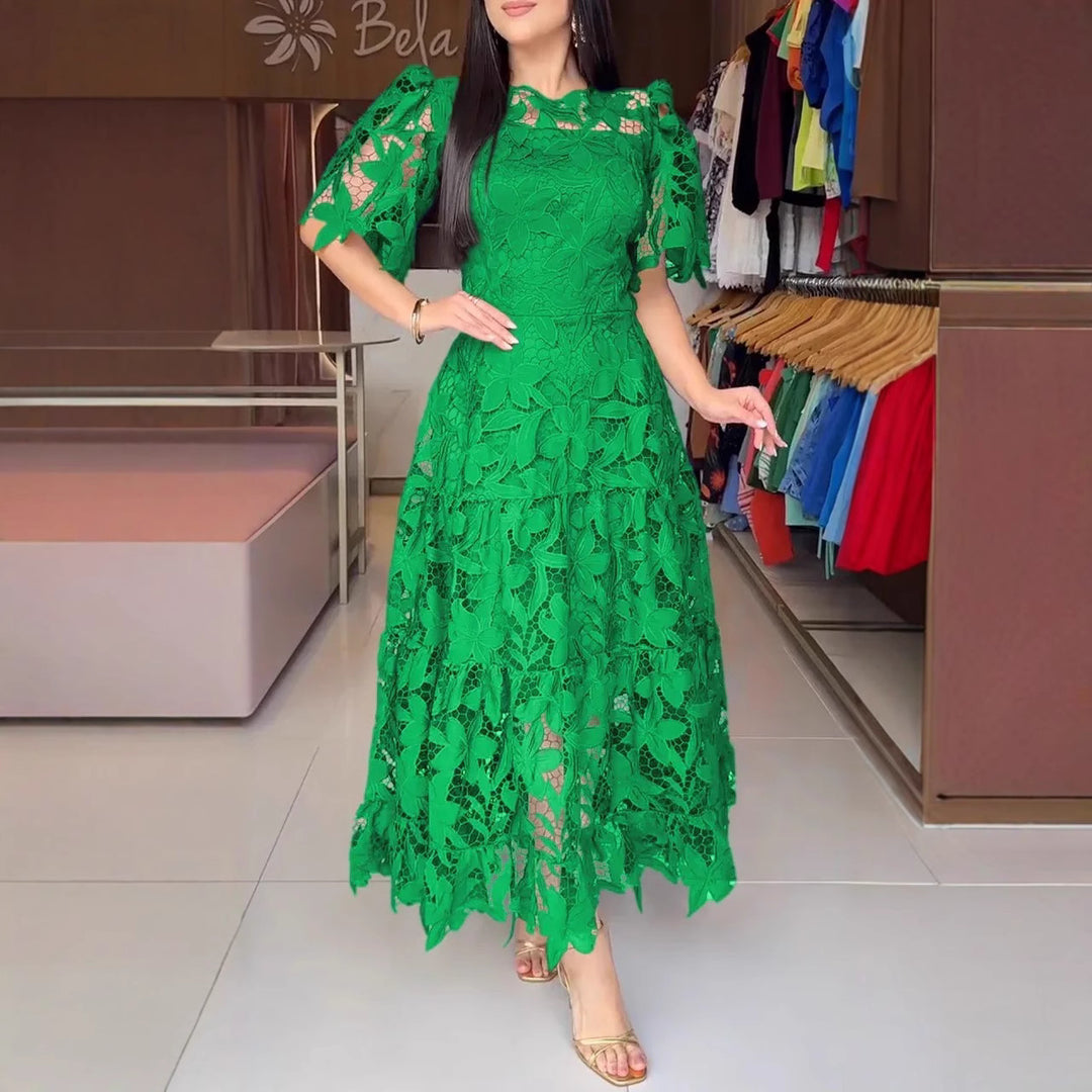 Women's maxi dress made of floral guipure lace with a fitted silhouette and tiered hem StylebySassy
