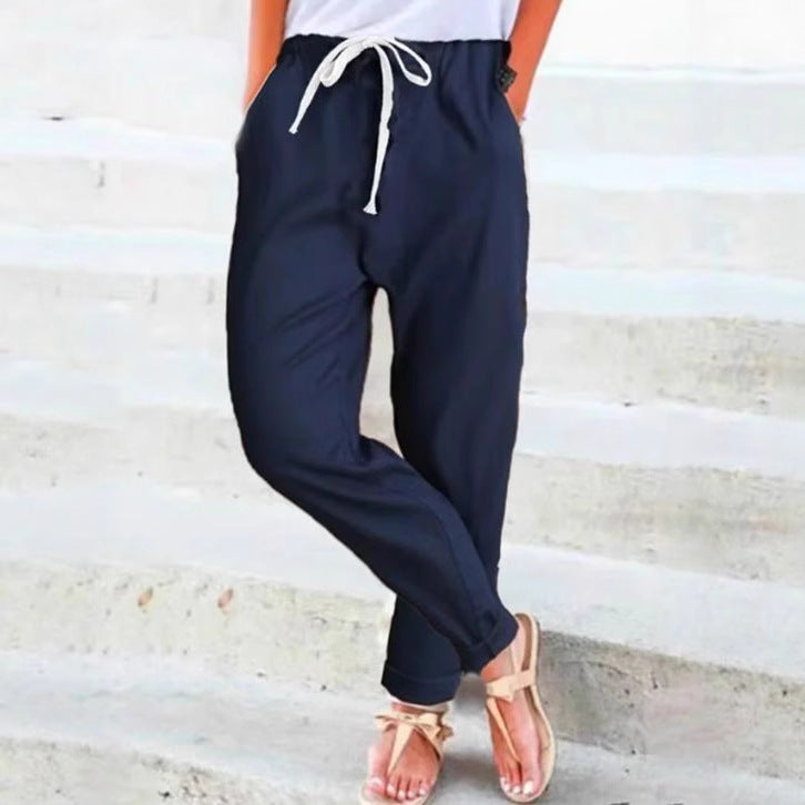 Women's light linen blend pants with elastic waistband, drawstring, and tapered ankle section StylebySassy