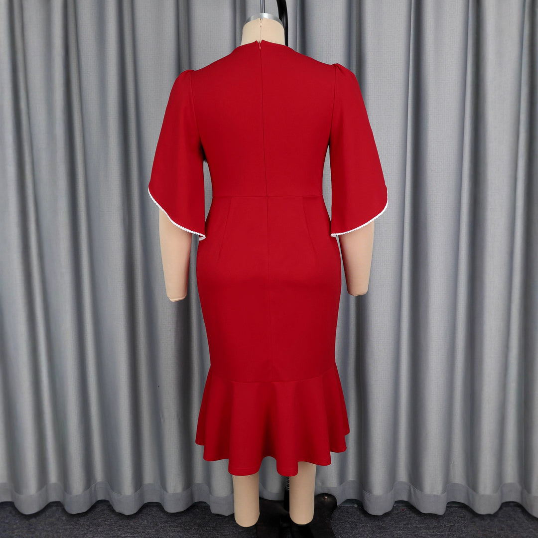 Ladies fitted evening dress with peplum and voluminous ruffle design StylebySassy