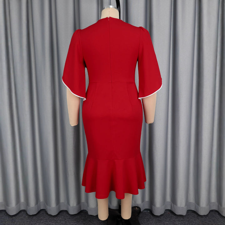 Ladies fitted evening dress with peplum and voluminous ruffle design StylebySassy