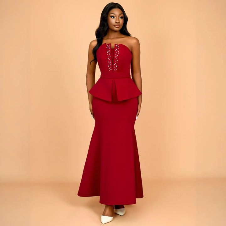 Women's evening dress with shimmering details and voluminous peplum drape