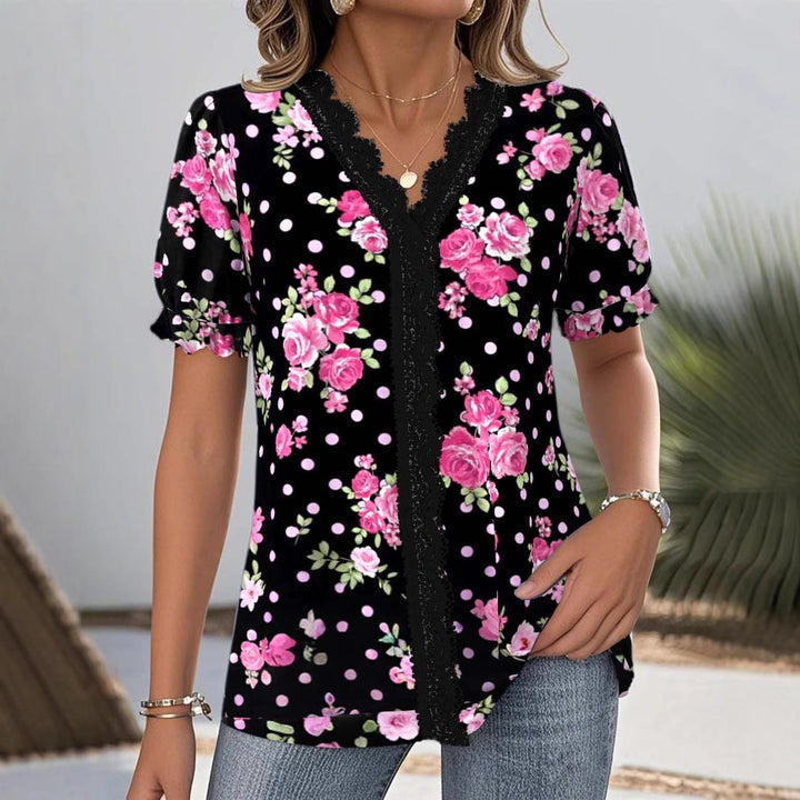 Ladies floral V-neck blouse with decorative lace trim and gathered short sleeves StylebySassy