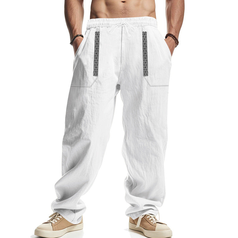 Men's loose-fitting casual pants made of linen blend with elastic waistband, deep side pockets, and ethnic decorative band StylebySassy