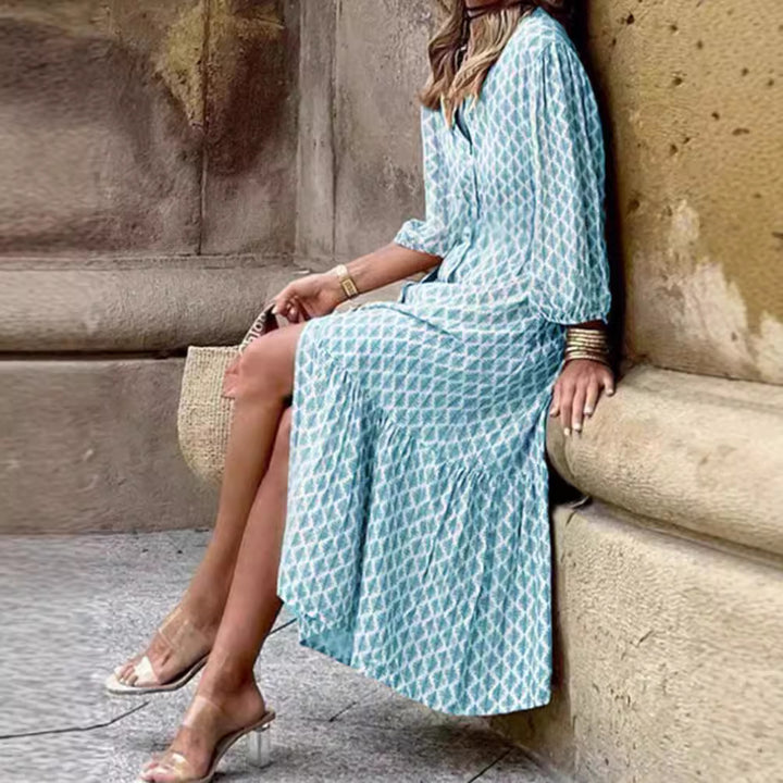 Women's lightweight patterned midi dress with V-neck, button placket, tiered skirt, and balloon sleeves StylebySassy