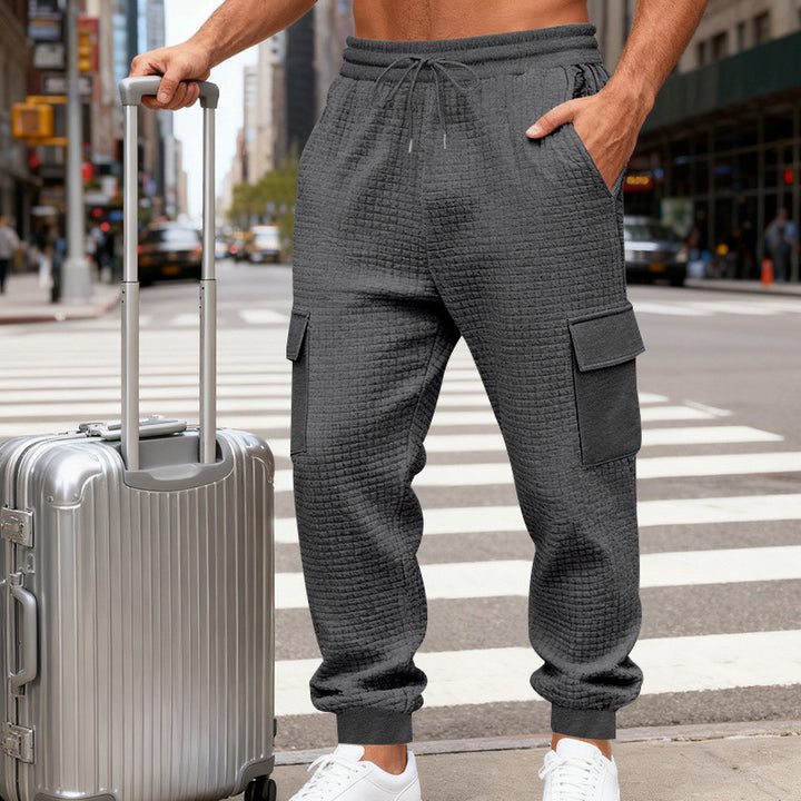 Men's waffle texture cargo pants in jogging style with flap pockets and elastic waistband StylebySassy