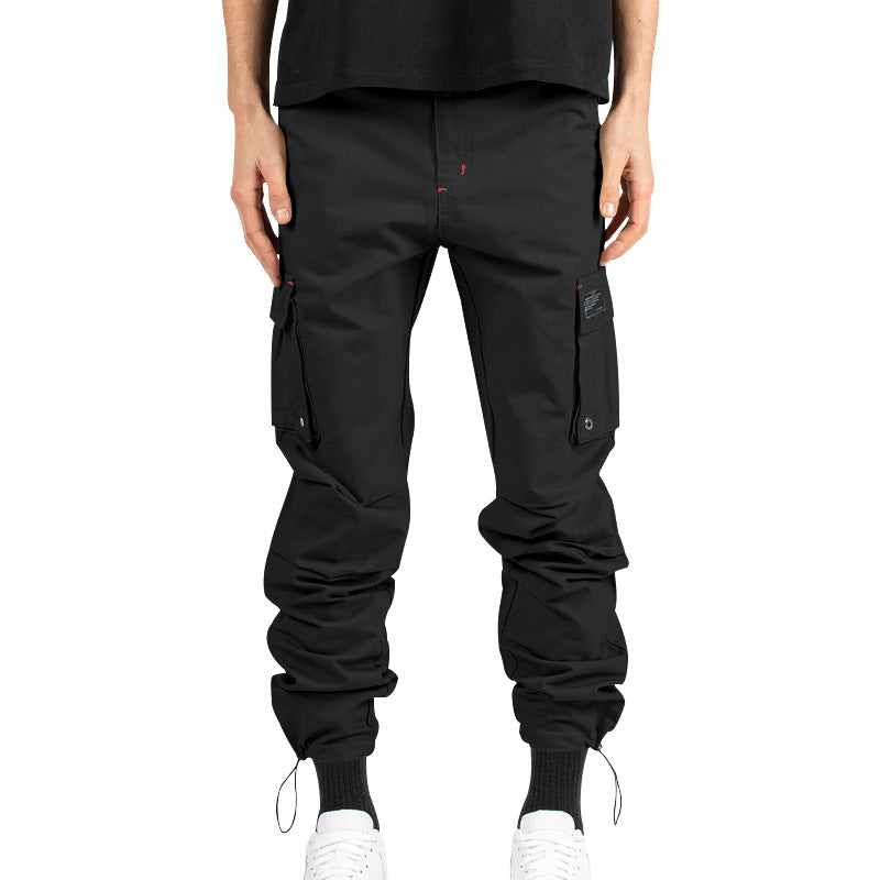 Men's multi-pocket casual trousers made of cotton twill with tapered leg and adjustable ankle drawstring StylebySassy