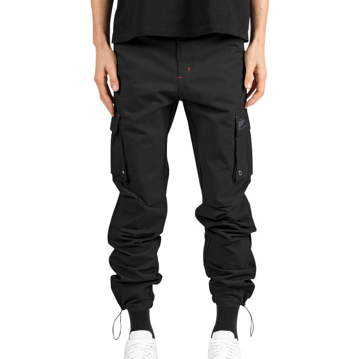 Men's multi-pocket casual trousers made of cotton twill with tapered leg and adjustable ankle drawstring StylebySassy