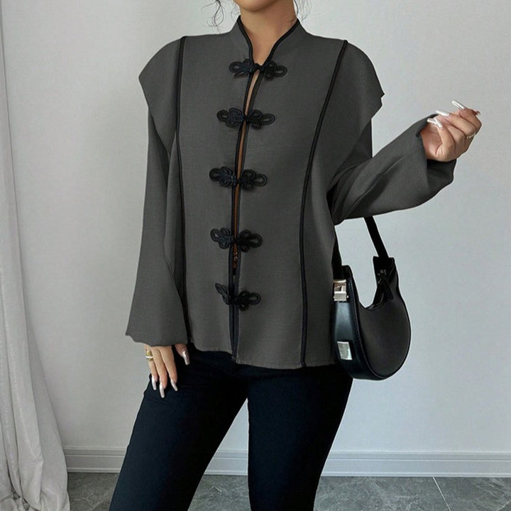 Women's stand-up collar blouse with decorative knot closures and decorative piping StylebySassy
