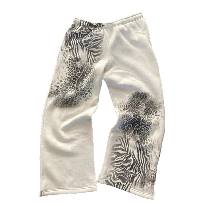 Women nan loose sweatpants with asymmetrical animal print, elastic comfort waistband and straight leg StylebySassy