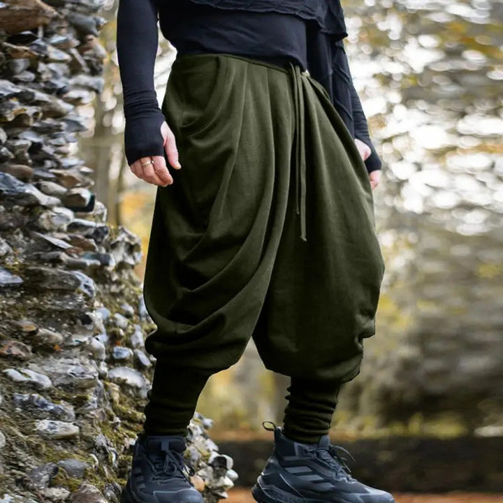 Men's avant-garde harem pants with wrap front, elastic waistband, and slim ankles StylebySassy