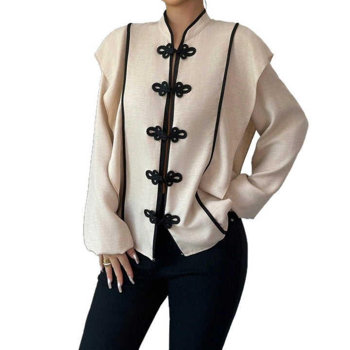 Women's stand-up collar blouse with decorative knot closures and decorative piping StylebySassy