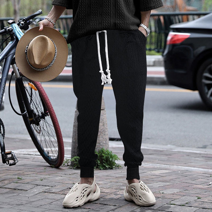 Men's textured knit jogging pants with distinctive drawstring and ribbed ankle cuffs StylebySassy