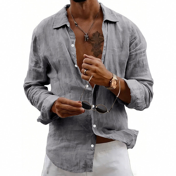 Men's airy relaxed linen shirt with open lapel, rounded hem, and roll-up sleeves StylebySassy