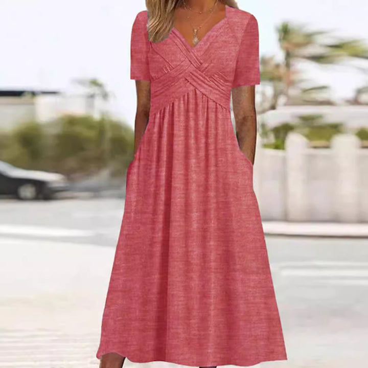 Women's flowing maxi dress with crossed yoke V-neck short sleeves and side pockets StylebySassy