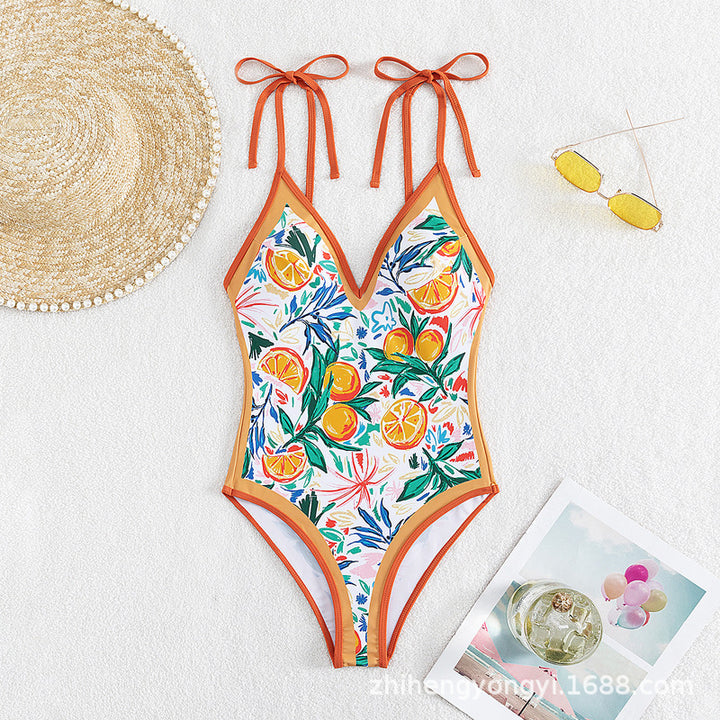 Women's swimsuit with vibrant plant and fruit motif StylebySassy