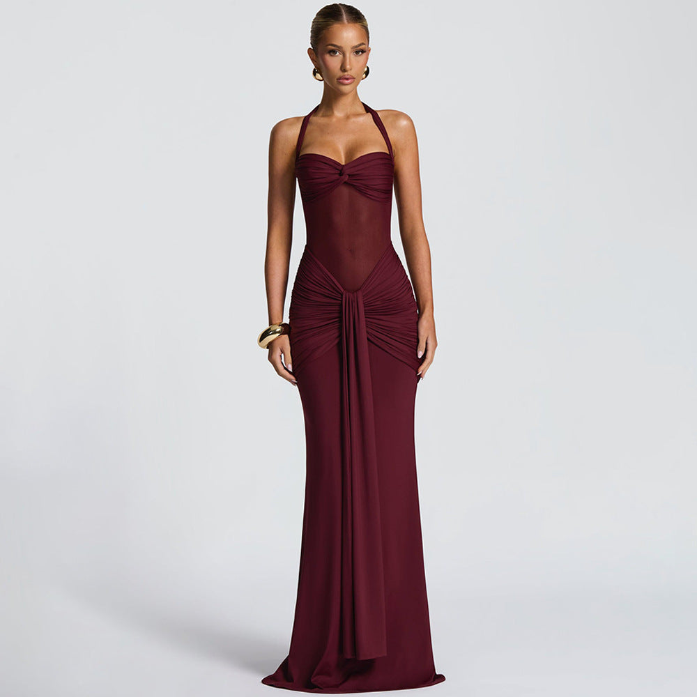 Women's figure-hugging halter evening dress with transparent mesh insert and gathered hip area StylebySassy