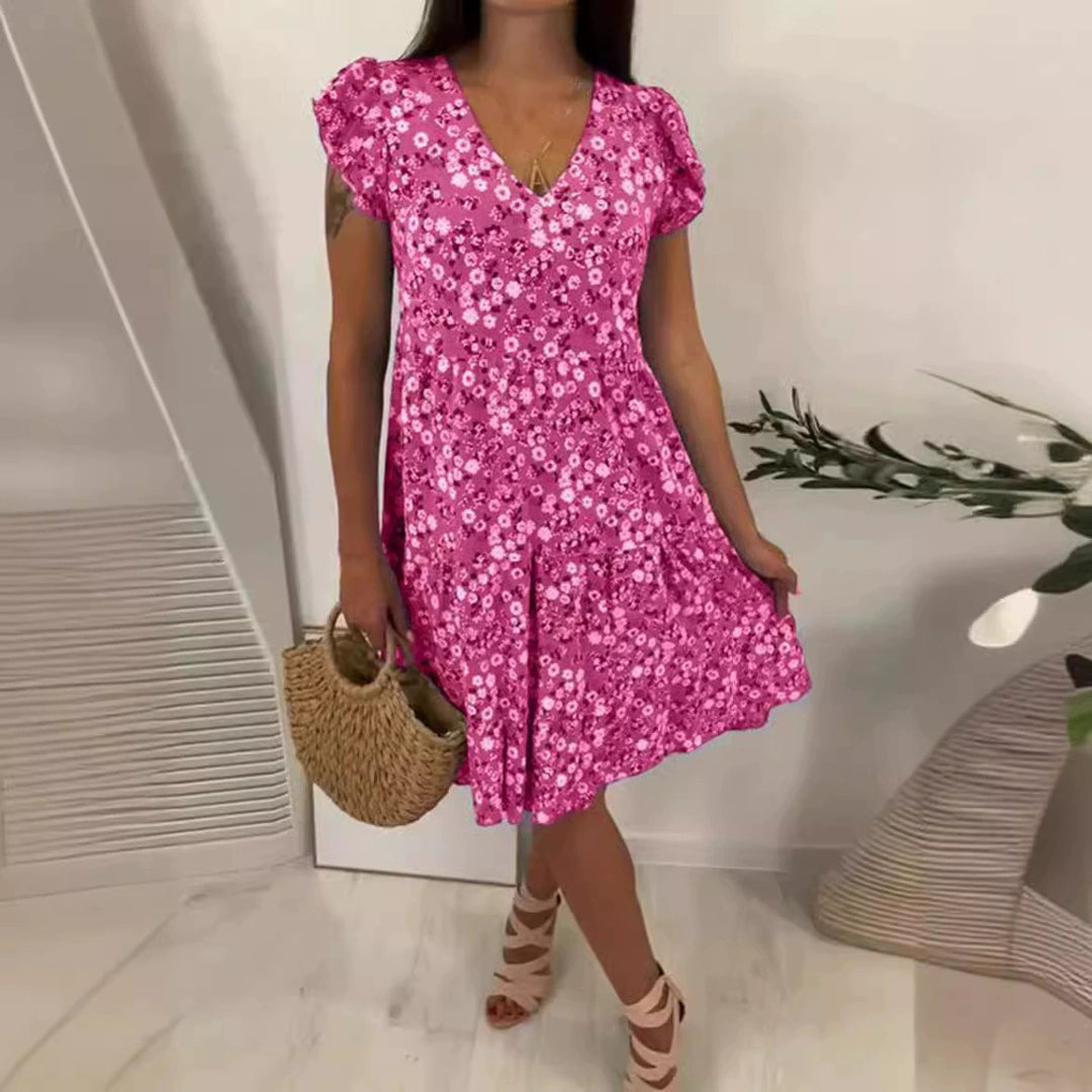 Women’s V-neck dress with gathered waist seam, short flounce sleeves, and tiered skirt StylebySassy