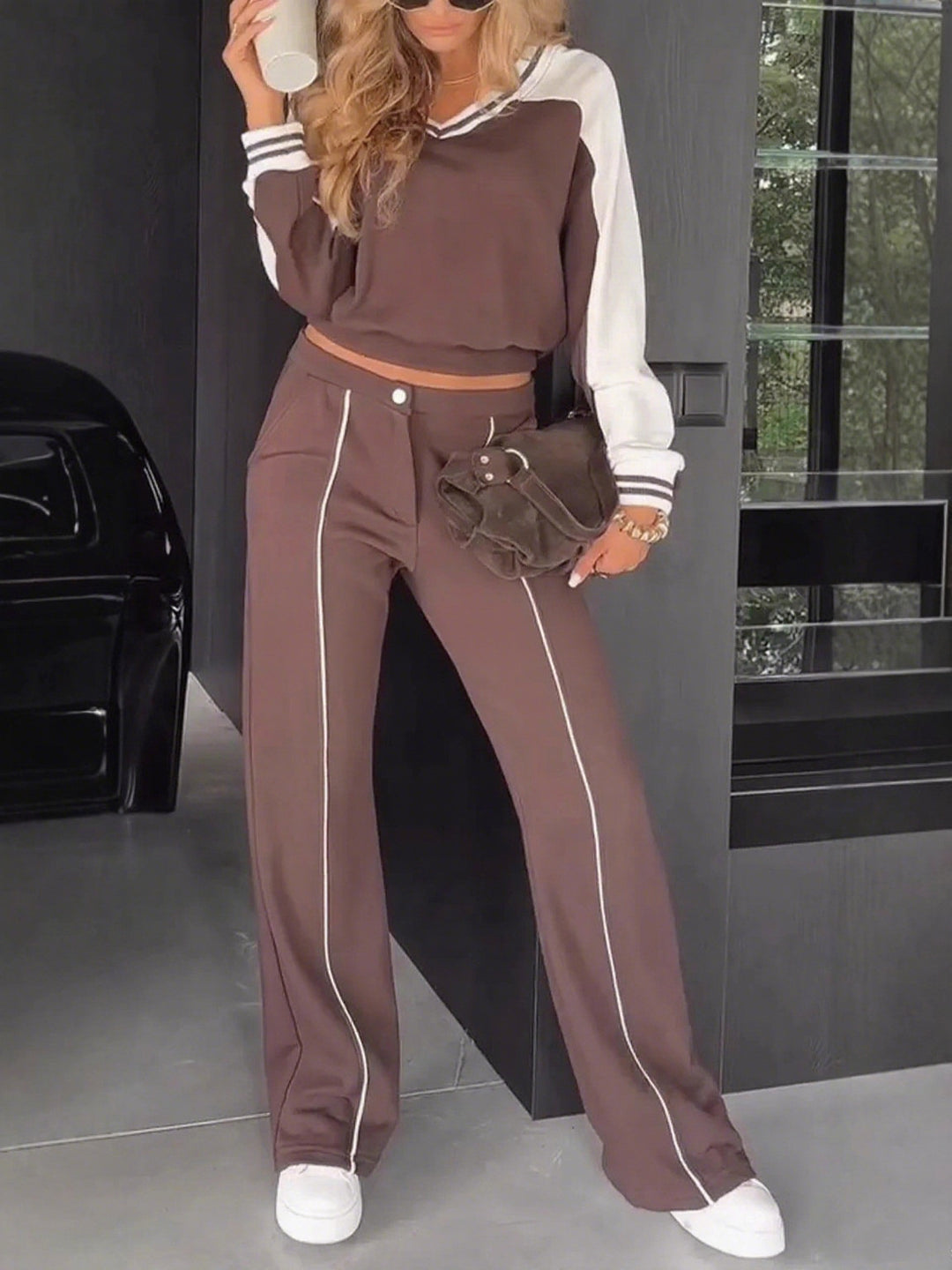 Women's sporty-elegant two-piece set made of cotton blend with V-neck sweatshirt and high-cut flared pants StylebySassy