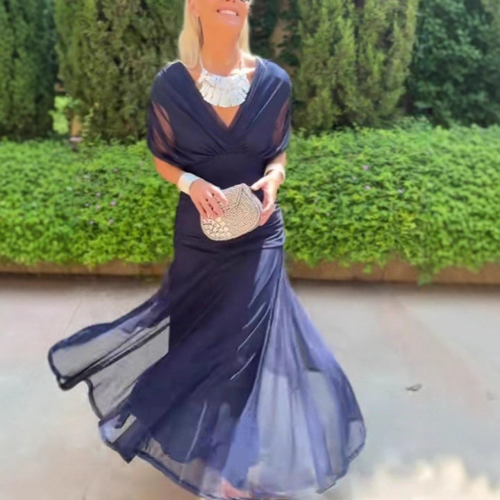 Ladies elegant floor-length evening dress with draped shoulder area and airy chiffon skirt StylebySassy