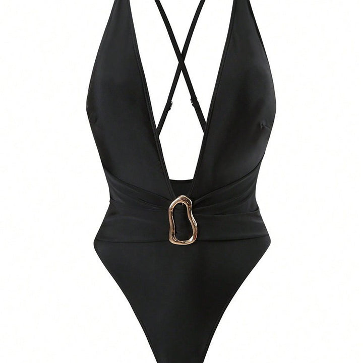 Women's one-piece swimsuit with deep V-neckline and elegant decorative element StylebySassy