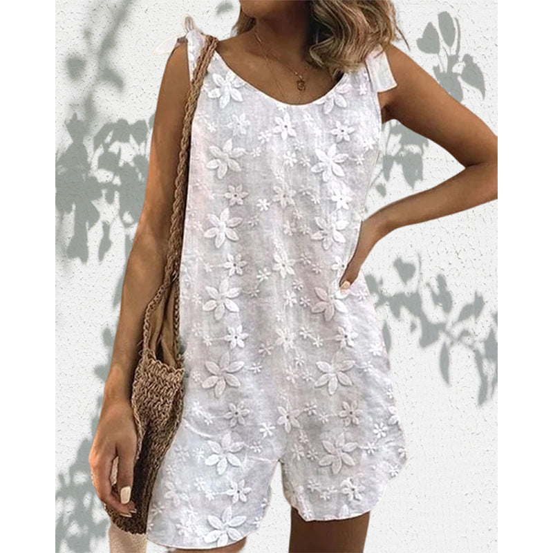 Women's lighter short overall with floral three-dimensional embroidery, adjustable tie straps and loose A-line silhouette StylebySassy