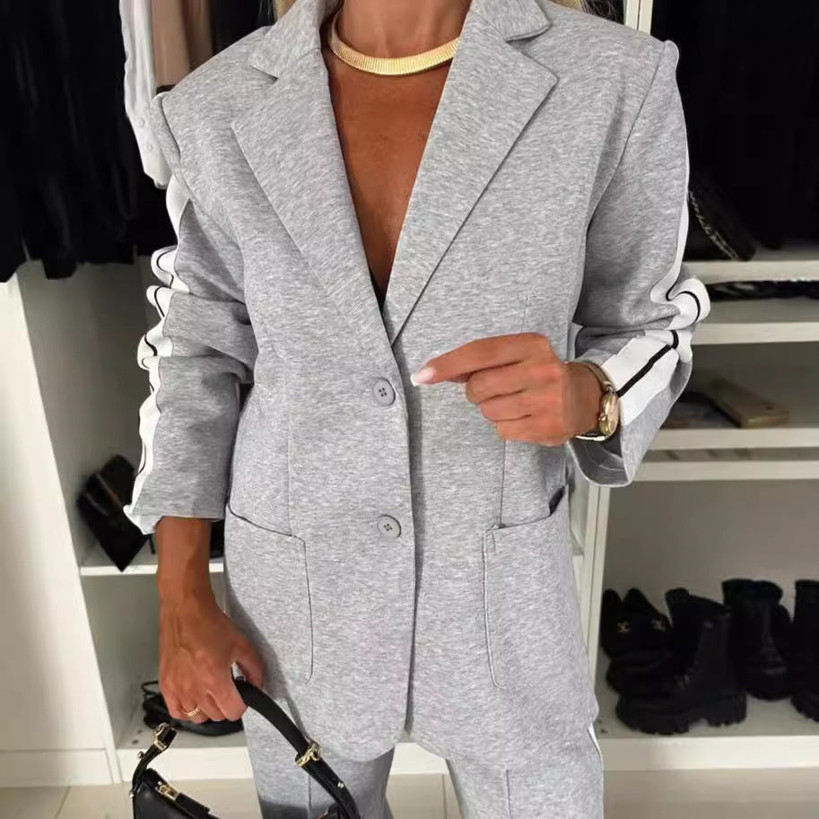 Women's elegant blazer set in sports chic with contrasting side stripes and elasticated waistband trousers StylebySassy