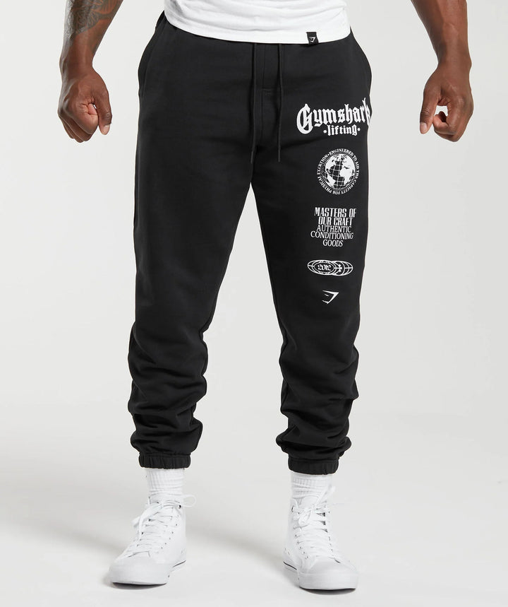 Men's tapered cotton fleece sweatpants with an elastic drawstring waistband, ribbed leg openings, and large logo print StylebySassy