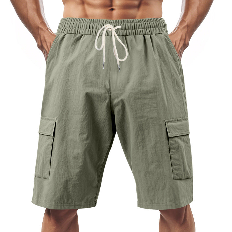 Men's technical cargo shorts with elastic drawstring waistband, secure flap pockets, and quick-drying functional material StylebySassy