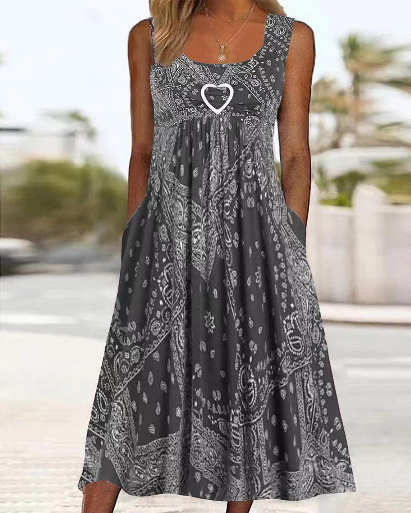 Women's airy maxi dress with paisley bandana print, gathered empire waist and practical side pockets StylebySassy