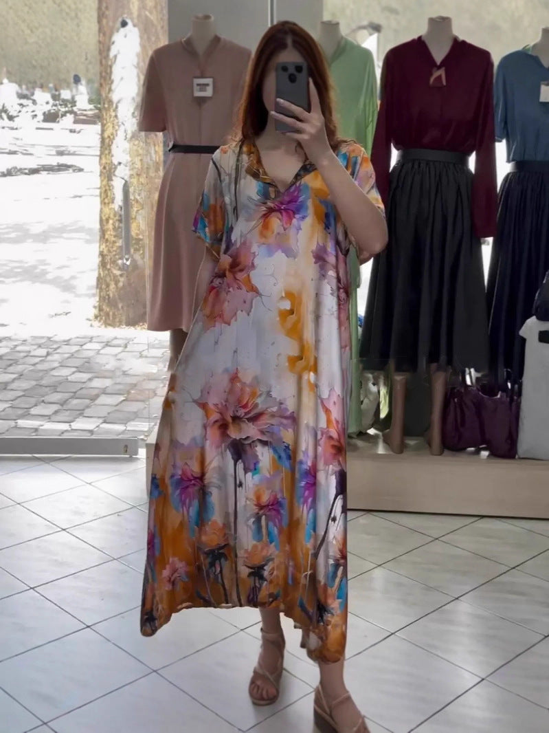 Women flowing maxi kaftan dress with V-neck and large watercolor floral print StylebySassy