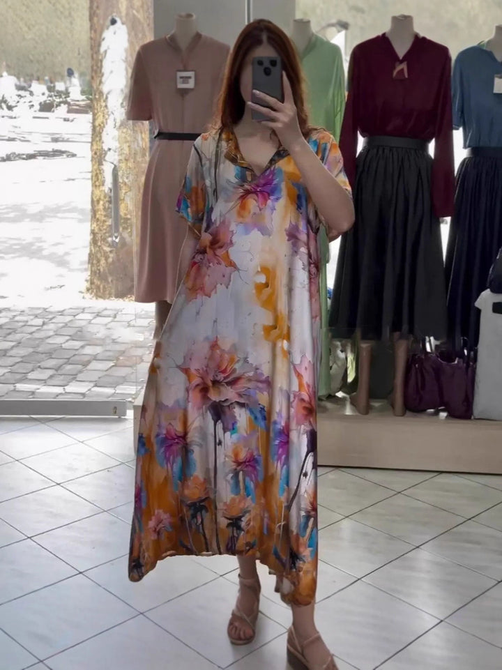 Women flowing maxi kaftan dress with V-neck and large watercolor floral print StylebySassy