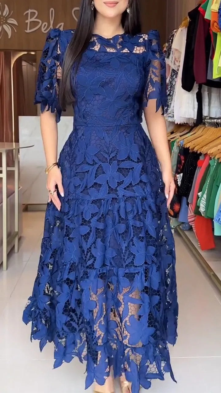 Women's maxi dress made of floral guipure lace with a fitted silhouette and tiered hem StylebySassy
